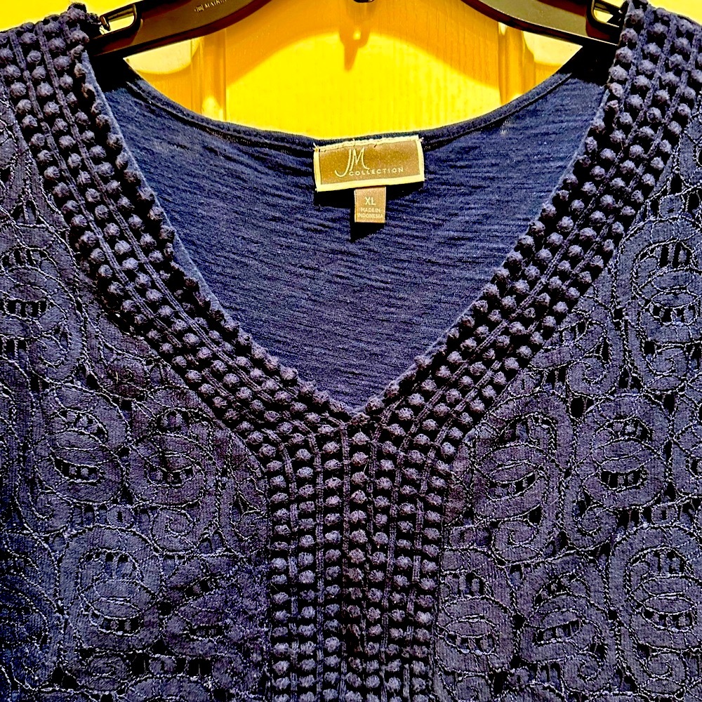 Navy shirt with lace design on front and cuffs.XL